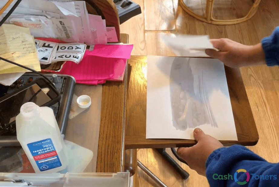 Sheet of paper moistened with isopropyl alcohol for a printer roller cleaning test